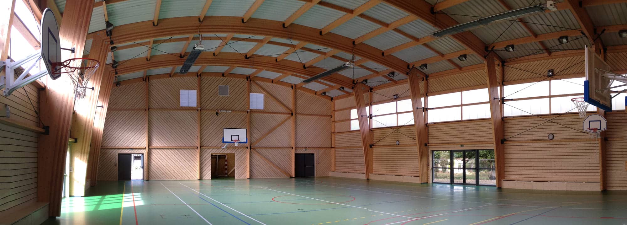 Construction d’une salle polyvalente à dominante sportive à Laroque-des-Albères – bâtiment bois durable conçu par ABC Architecture